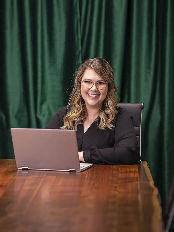 Serenette-Crombie-at-desk-portrait